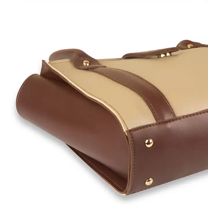 Coral beige handbag with minimalist design and structured elegant finish