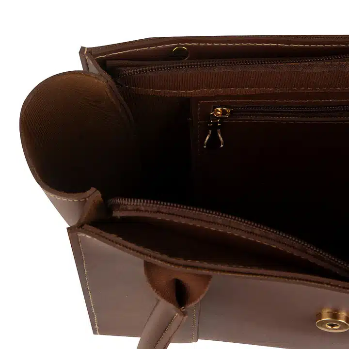 Stylish coral and brown handbag with spacious interior and organized storage