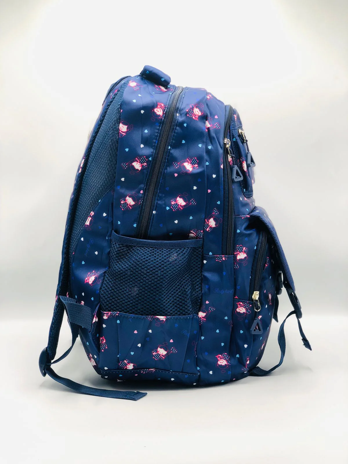 Pink 'Happy Time' backpack for girls featuring a playful design, multiple zippered compartments, and mesh side pockets for water bottles.