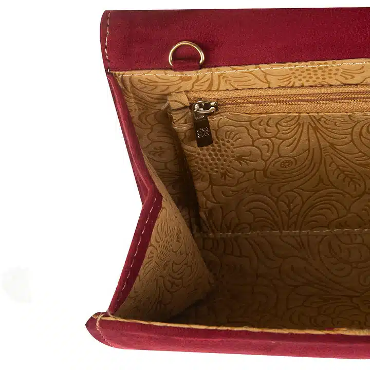 Elegant kiwi maroon clutch with organized interior and minimalist style