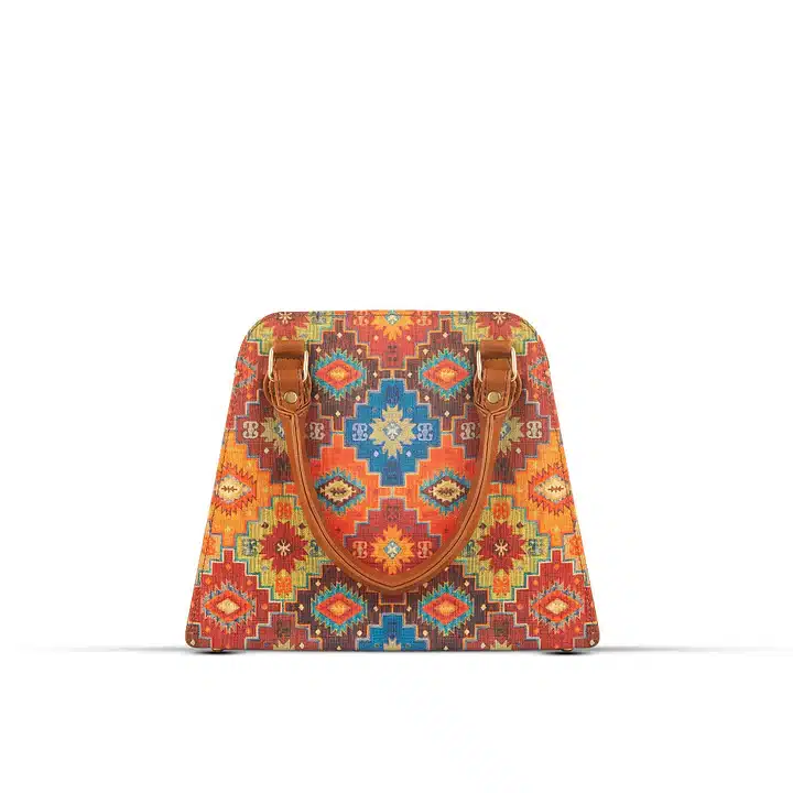 Colorful canvas art handbag with faux leather details and compact design