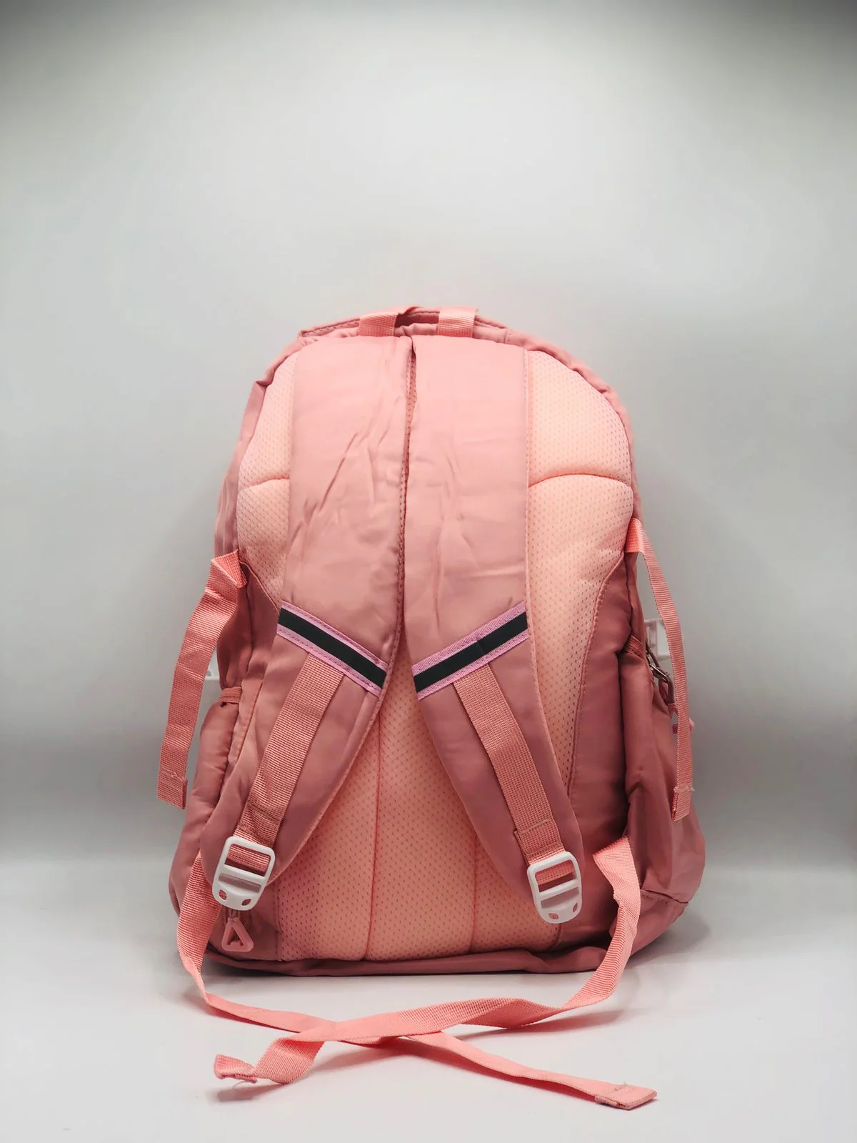 Cute Peach Backpack for Girls featuring a soft peach tone, lightweight design, and spacious compartments for everyday school and casual use.