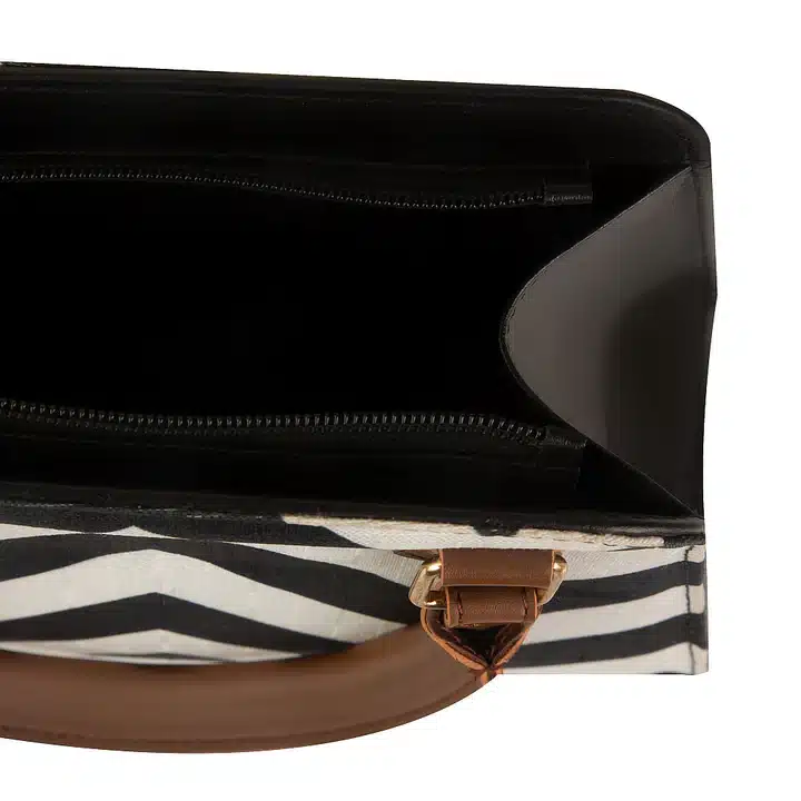 Stylish canvas and faux leather handbag with organized interior compartments