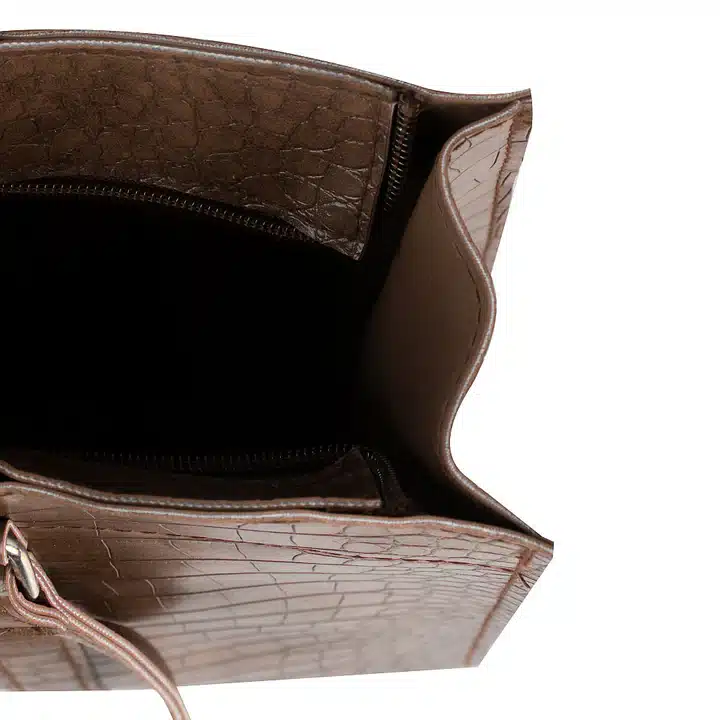 Stylish choco brown handbag duo displayed with spacious tote and compact crossbody bag