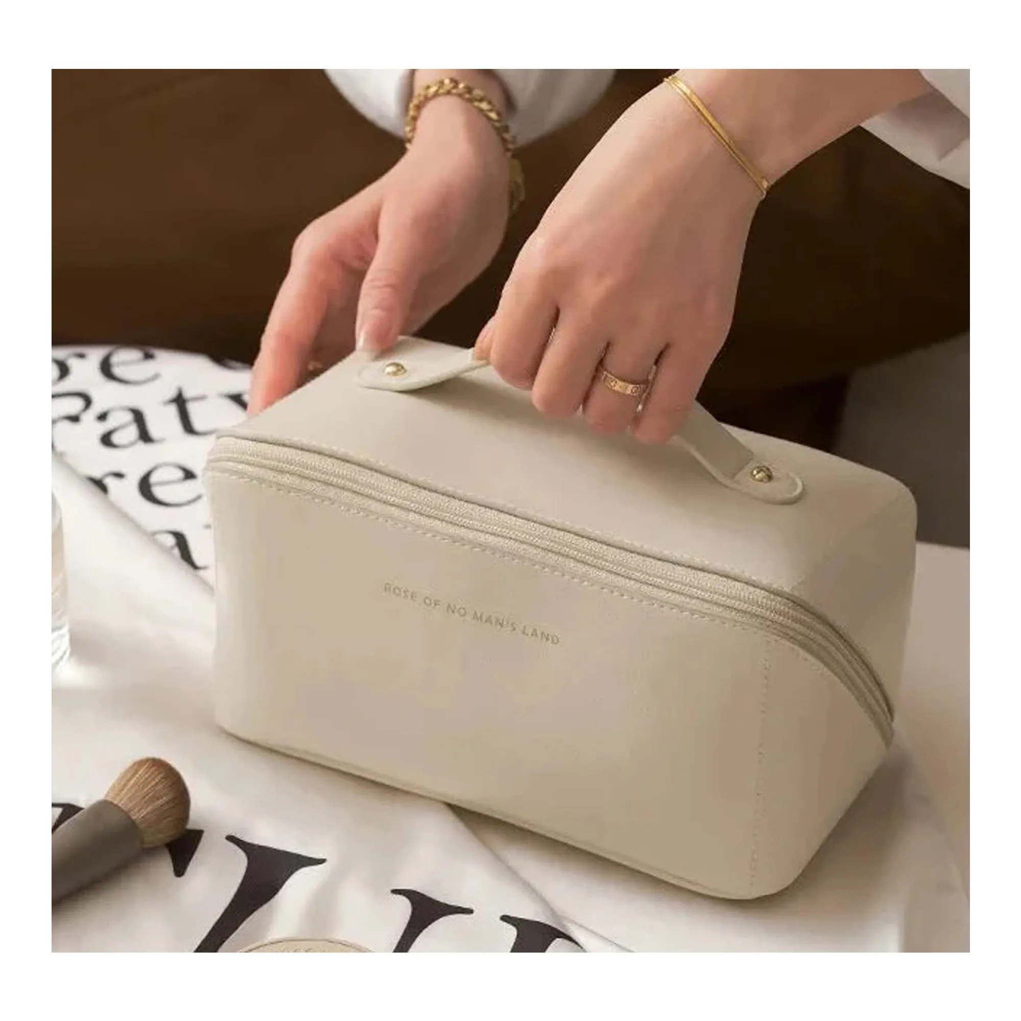 Side view of large capacity long leather cosmetic bag, travel makeup organizer, white